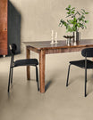 Balance Antique Brown Dining Table in a room setting