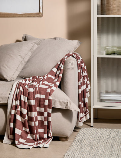 Ludo knitted throw in Terracotta