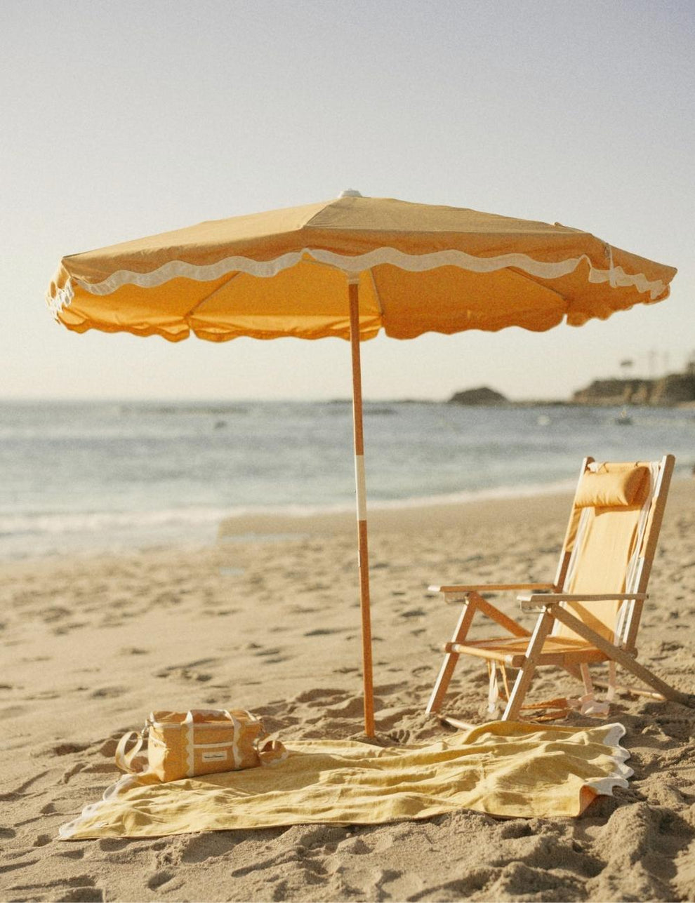 Mustard Yellow Luxury Beach Towel styled with matching umbrella