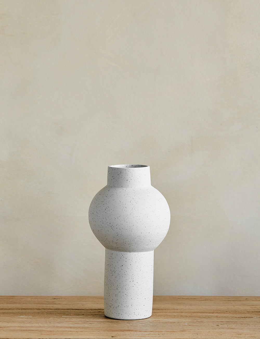 White Speckled Clay Vase on console
